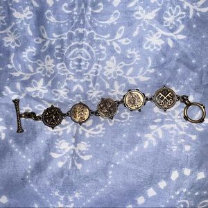 Vintage Bracelet with Turning Emblems